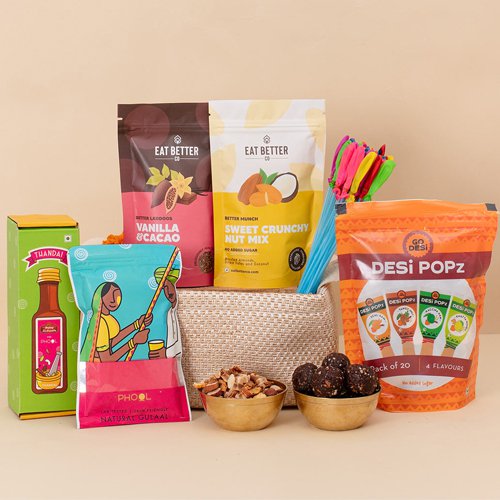 Blissful Sweet N Savory Treats Hamper with Organic Gulal N Water Balloons