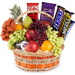 Pleasurable Chocolates with Mixed Fruits in a Basket